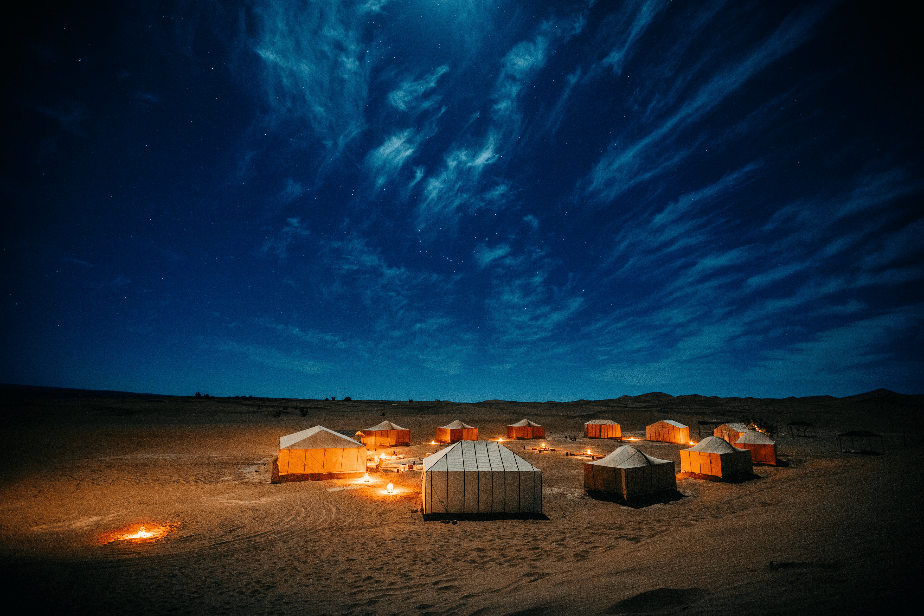 Starry night above a desert campsite